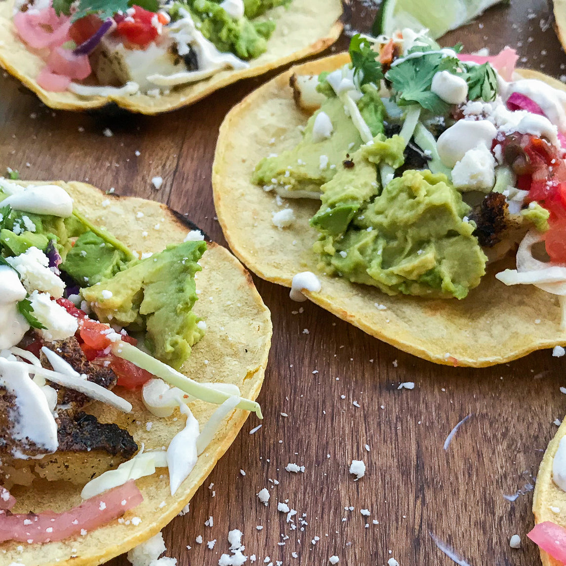 Cajun Blackened Sea Bass Tacos with Pickled Red Onions and Cumin-Lime White Sauce