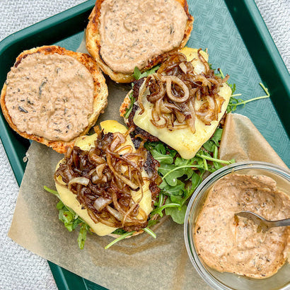 Cheeseburgers with Black Garlic Aioli and Caramelized Onions