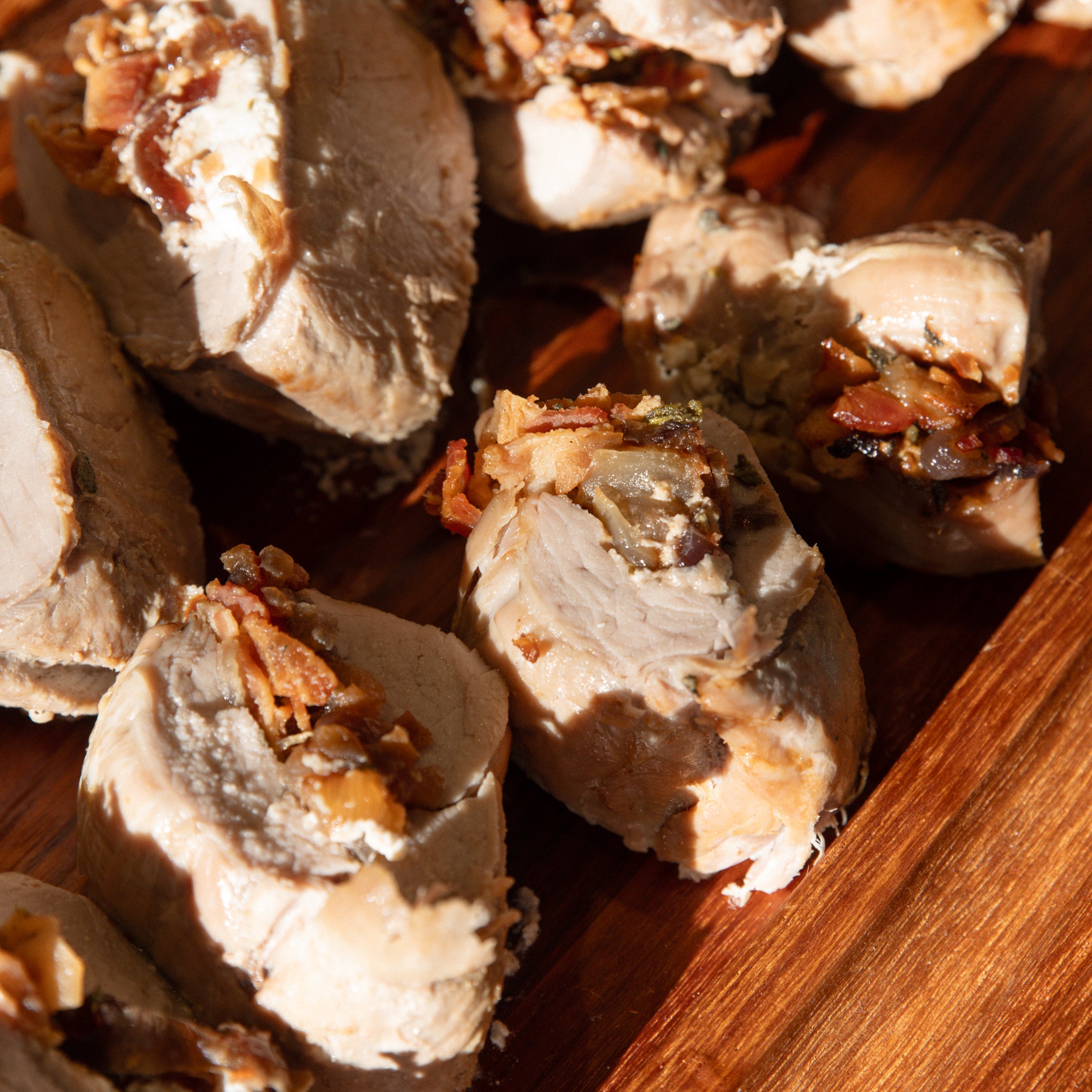 Stuffed Pork Tenderloin with Caramelized Onions, Goat Cheese and Bacon