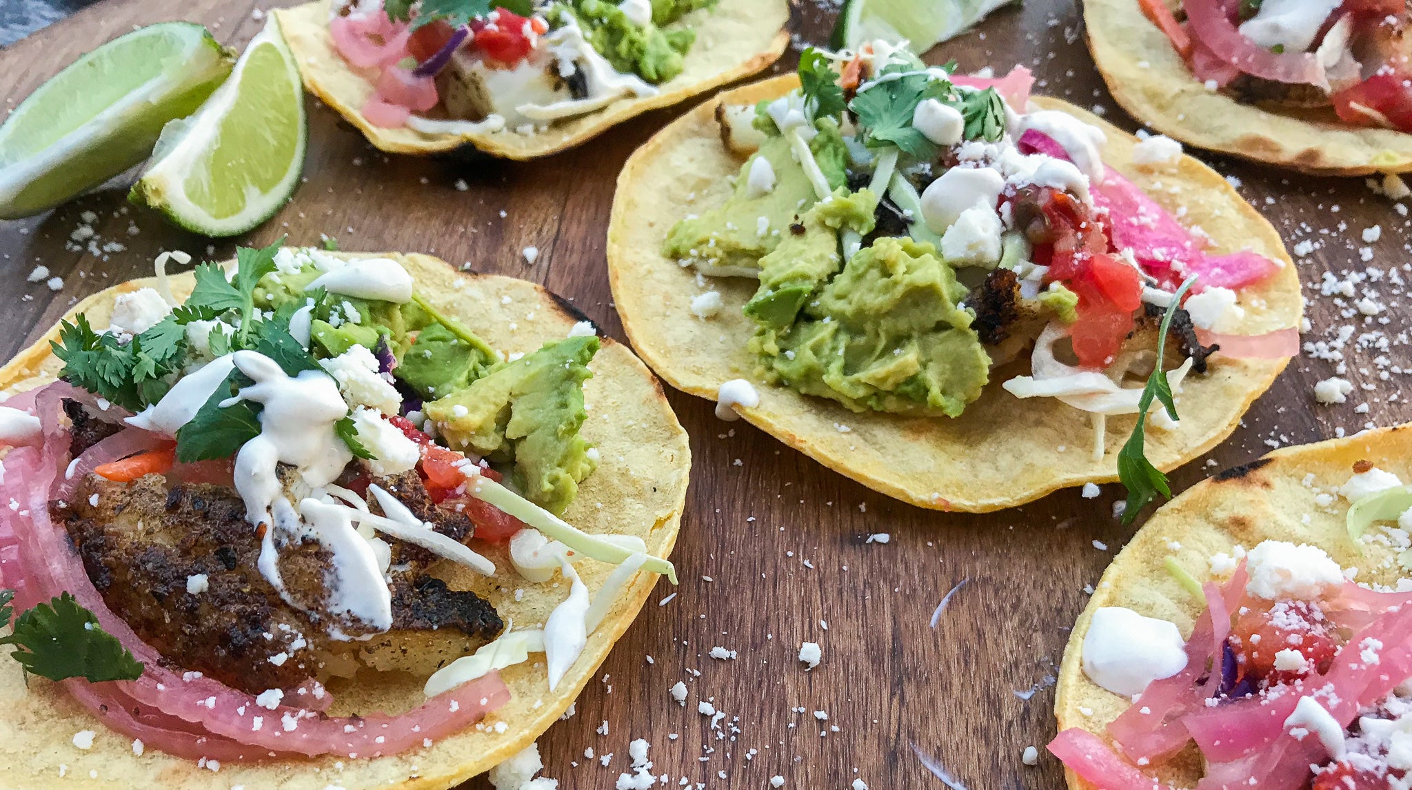 Cajun Blackened Sea Bass Tacos with Pickled Red Onions and Cumin-Lime White Sauce